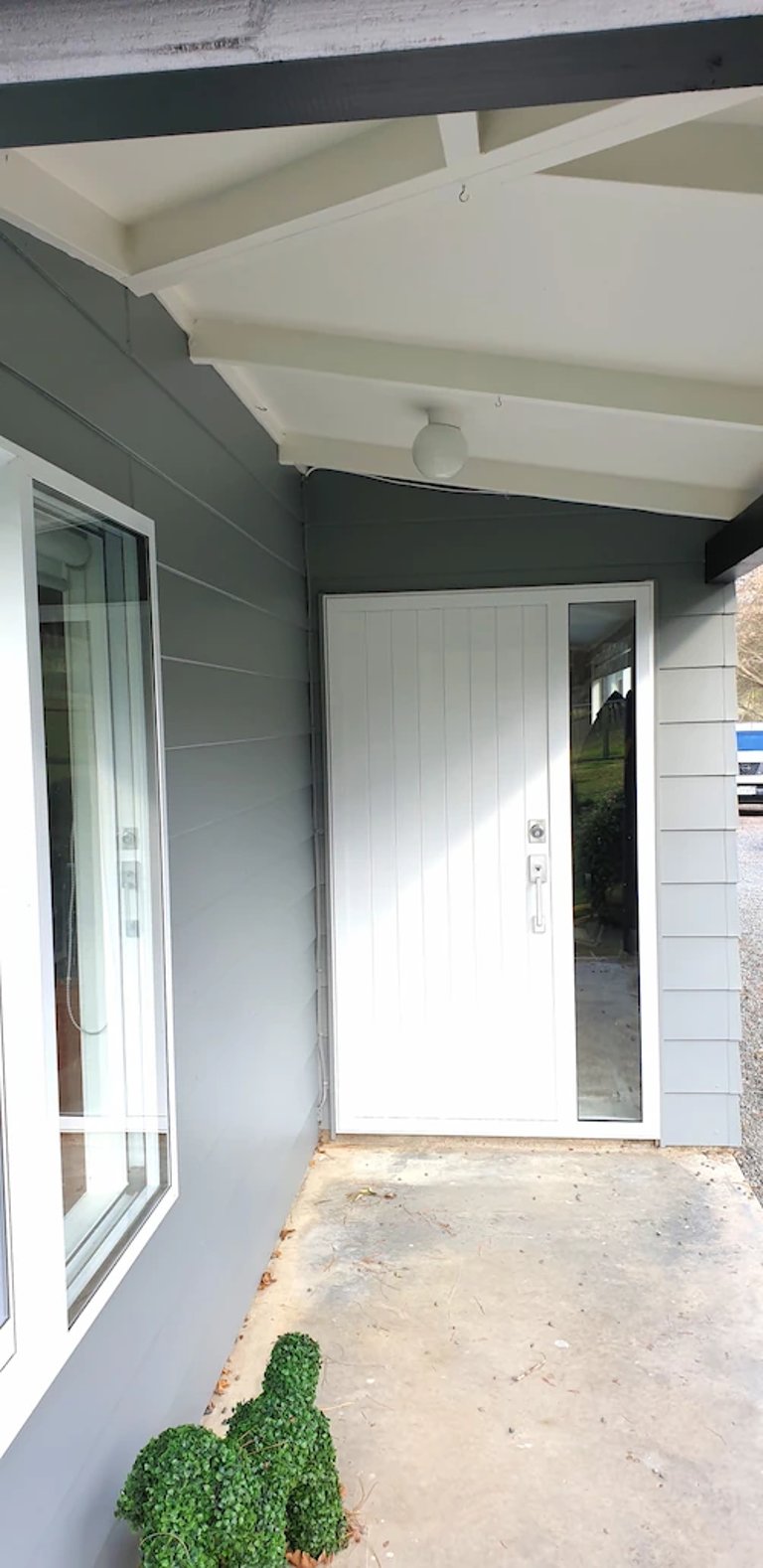 Freshly painted gray entry with white trim and door, completed by Glen Currie of Gee Cee Painter for a crisp finish