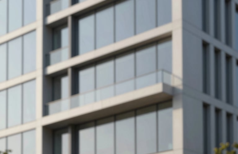 An abstract, architectural composition of clean lines and geometric shapes representing order and structure. A modern building facade with glass and steel, reflecting a clear sky. Brand colors #2D2424 and #F0EAD6 are prominent.