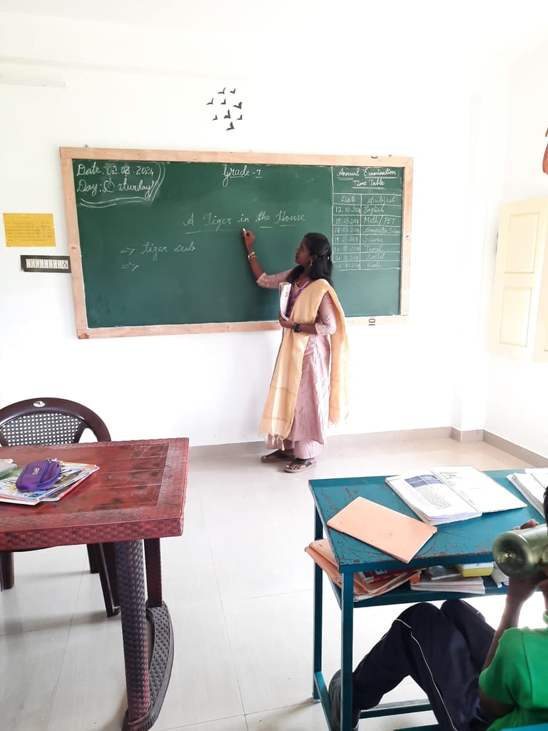 Teacher providing personalized tuition for primary school children at Little Cubs Learning Academy