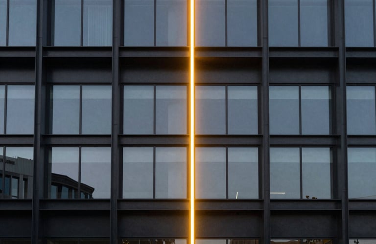 Photography of a modern architectural structure made of black steel and glass, illuminated by a single vertical neon yellow light beam. Symmetrical composition, minimalist tech vibe.