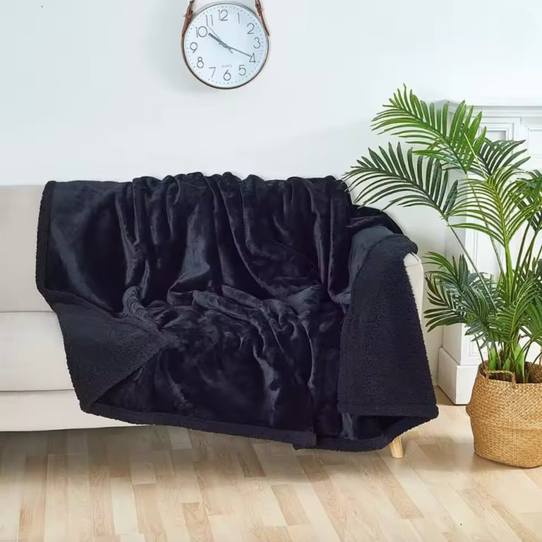 Soft plush throw blanket on sofa, cozy home decor inspiration.