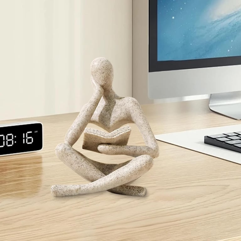 Abstract Thinker statue on office desk, elegant home office decor