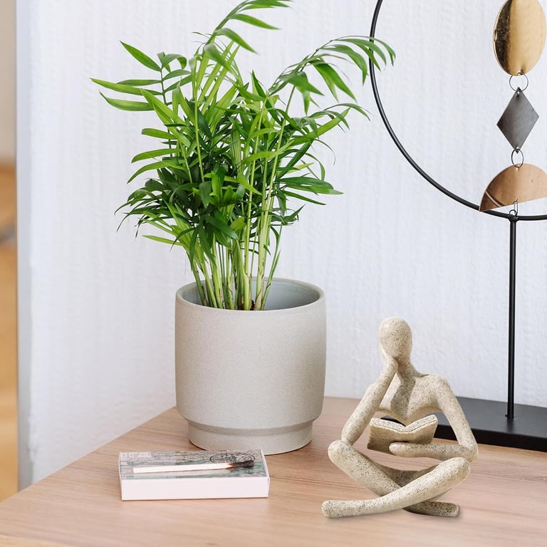 Thinker sculpture styled as a decorative gift in modern home