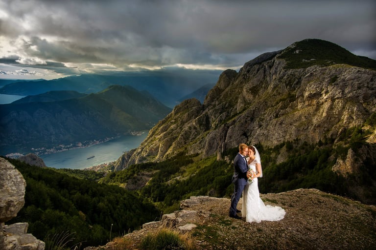 Wedding couple on the mountain above Kotor, with view of Boka bay