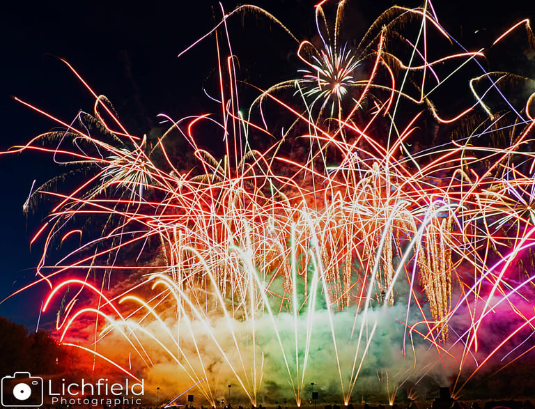 Firework light trails in rainbow colours 