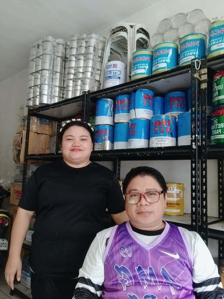 Hotmix Painting Services team collaborating on paint product selection for homeowner projects