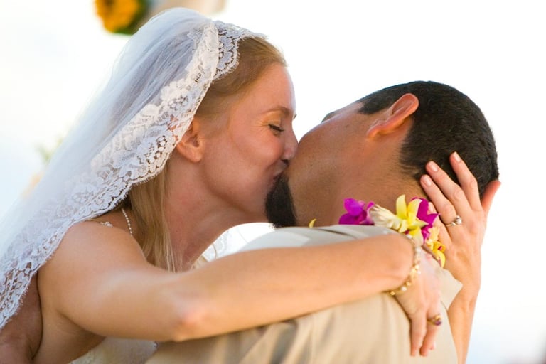 Beach Destination Wedding. Bride and Groom kissing. San Jose del Cabo, Mexico.