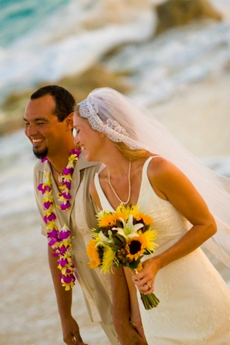 Beach Destination Wedding. Bride and Groom Photo Shoot. Walking and smiling on the beach. San Jose del Cabo, Mexico.