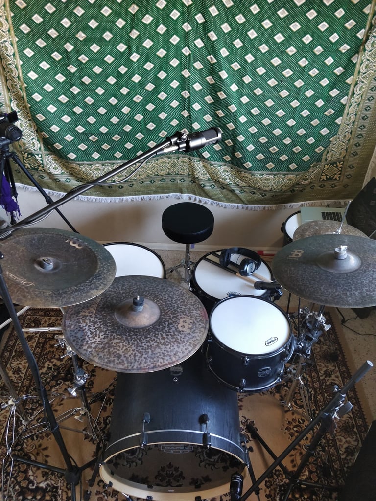Live audio recording of a full drum set. Kick, Snare, Toms, Hi-Hats, Ride, Overheads, and Room mics.
