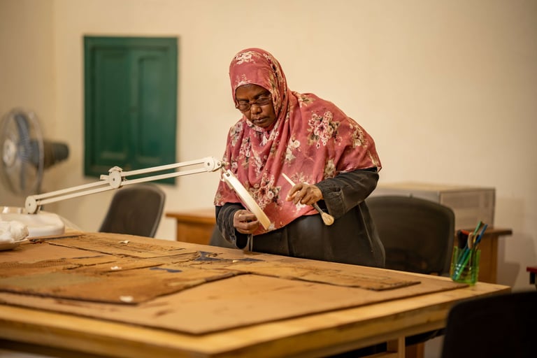 Sudanese woman restoring historical manuscripts