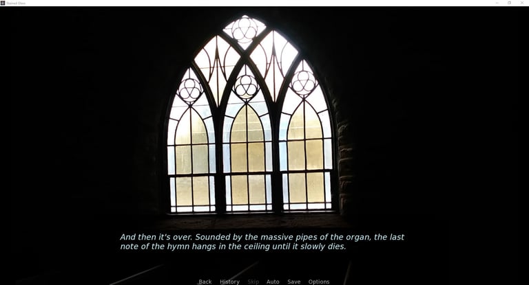 An arched stained-glass window set in shadowy church interior