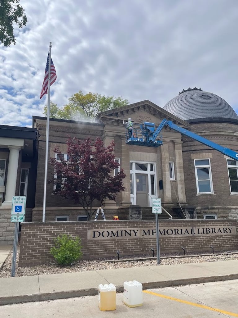 Photo of Pressure washing Fairbury Dominey Memorial Library Man in Lift Washing 