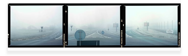 Composite photograph  of a foggy road junction with traffic signs, each frame revealing a unique part of the narrative.