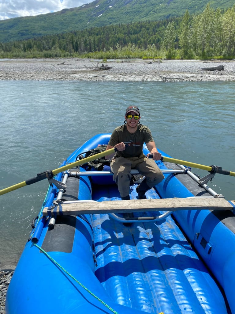Man on Raft in Alaska on a River