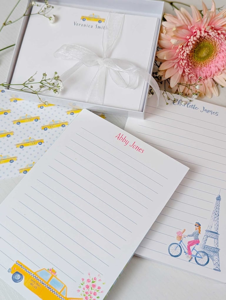 Personalized stationery including notepads and notecards with taxi and eiffel towner.