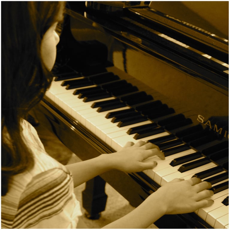 Girl improvising music on a piano