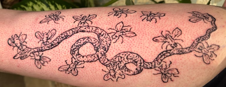 Claude Paradin snake tattoo by Steve Sype