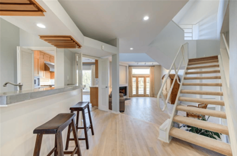 Renovated floor, view past kitchen and living room