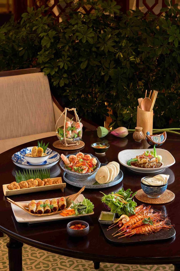 A gourmet spread of traditional Vietnamese cuisine featuring grilled shrimp, spring rolls, and seafood dishes.