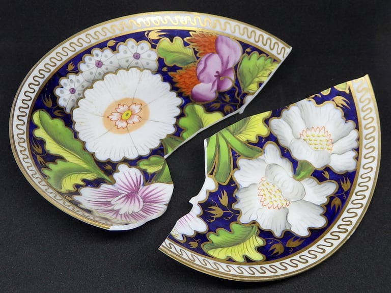 Broken New Hall floral saucer before conservation