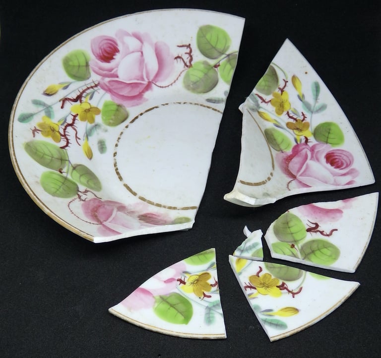 Broken New Hall floral saucer before conservation