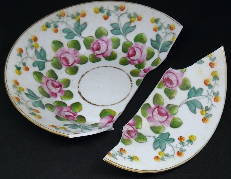 Broken New Hall floral saucer before conservation