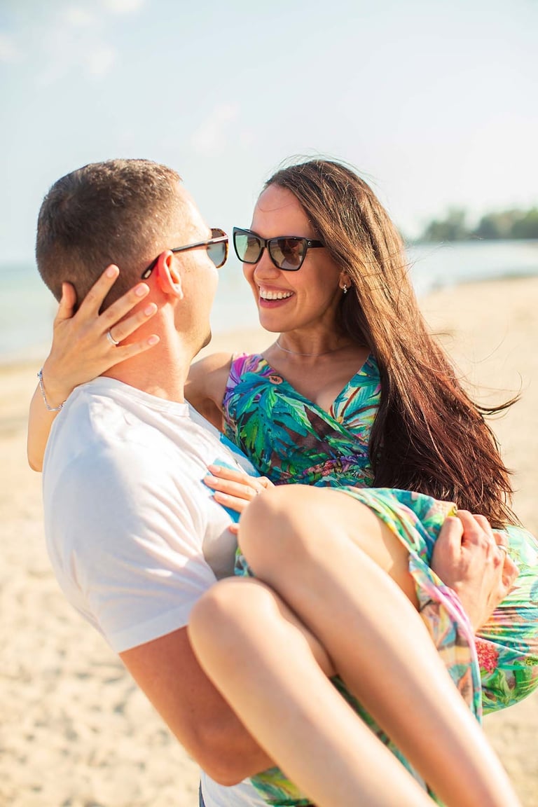 Couple laughing on Sunset Town beach in Phu Quoc