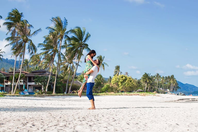 Couple lift pose on Khem Beach in Phu Quoc