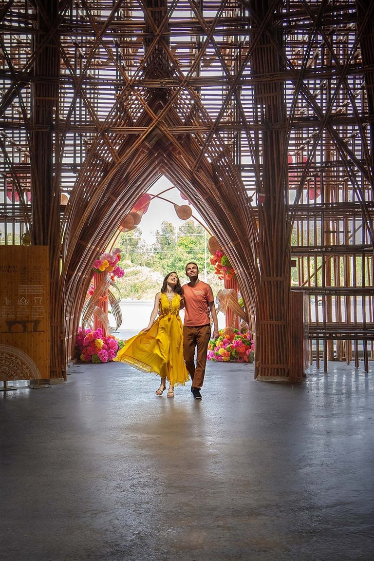 Couple walking through Bamboo Legend arch in Grand World