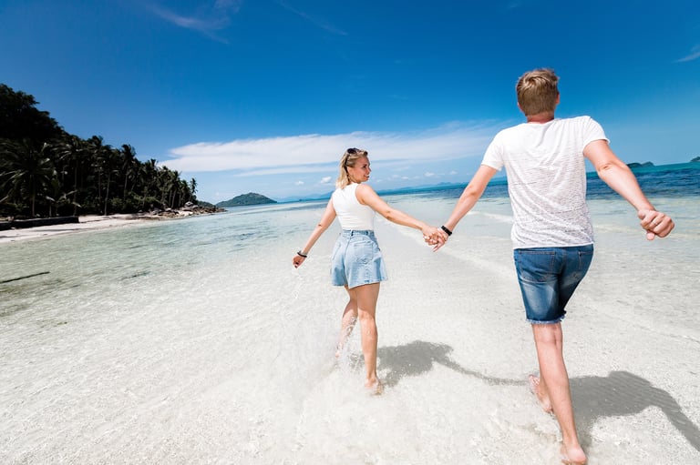Couple walking in sea near Sheraton, Phu Quoc photographer