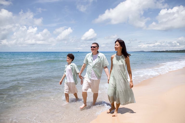 Family walking along Sheraton beach in Phu Quoc