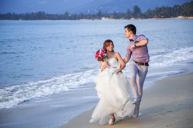 Wedding couple running on beach near InterContinental Phu Quoc