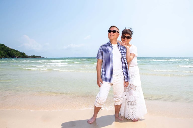 Mature couple embracing on sunny Long Beach shoreline