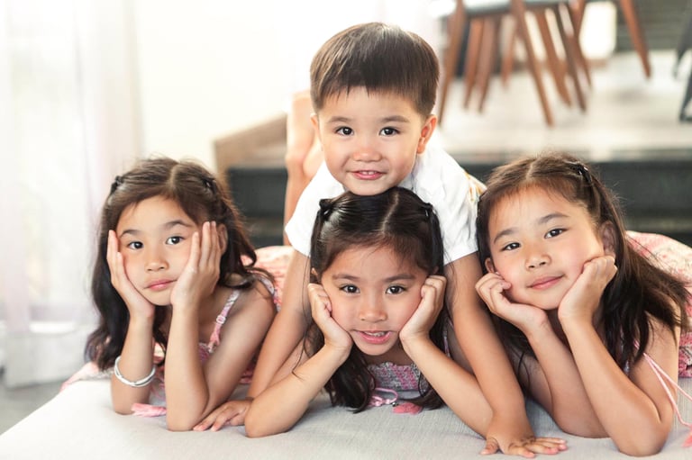 Four kids relaxing together at New World Phu Quoc