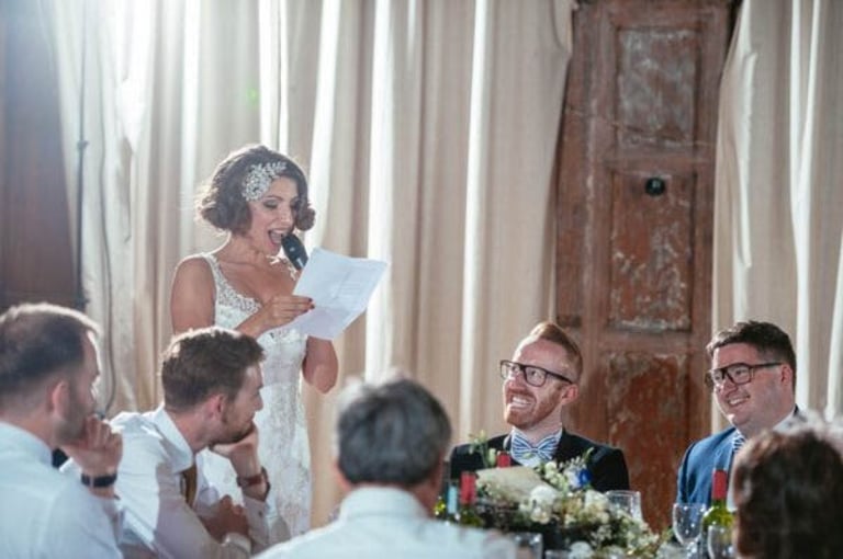 Bride giving wedding speech to guests at Battersea Arts Centre, captured in natural candid style by photographer Owen Mat