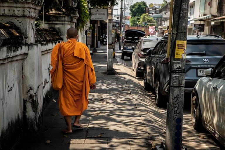 Buddhist monk walking down the street