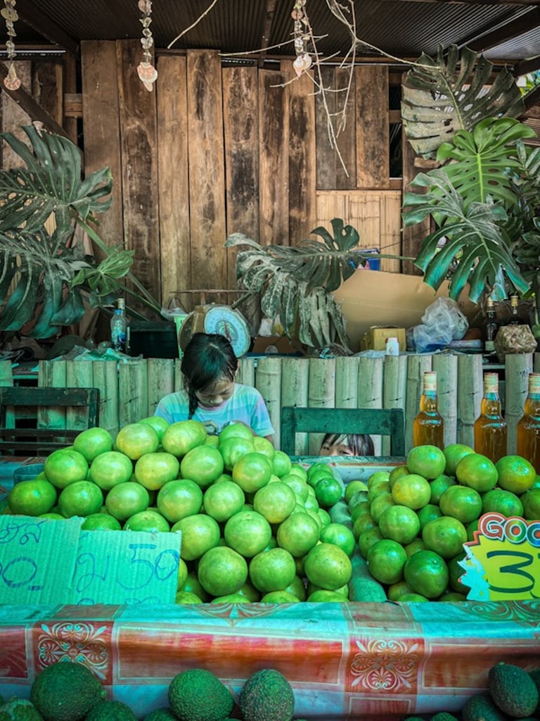 Indonesian girls selling fruit on the street