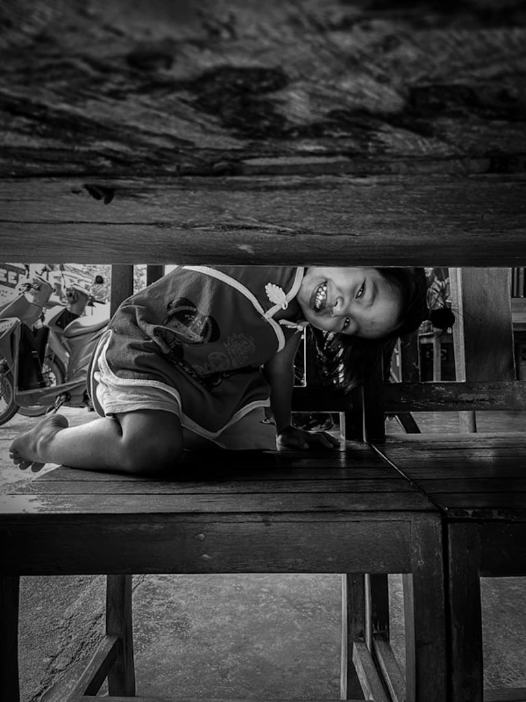 Thai girl smiling while playing