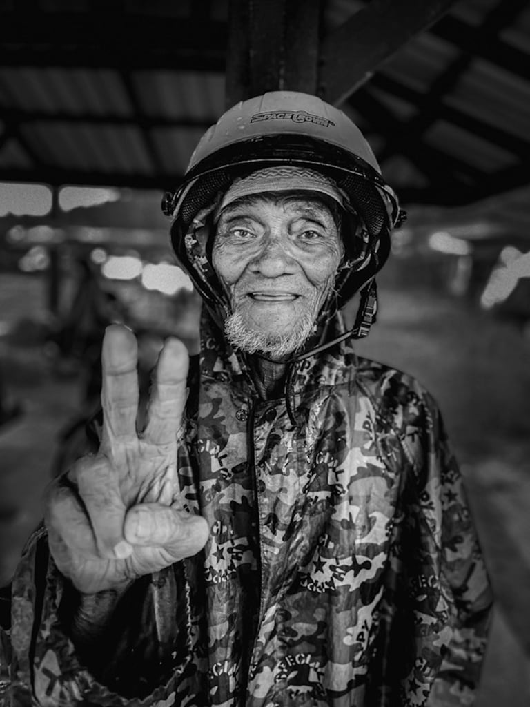 Thai motorcyclist smiling