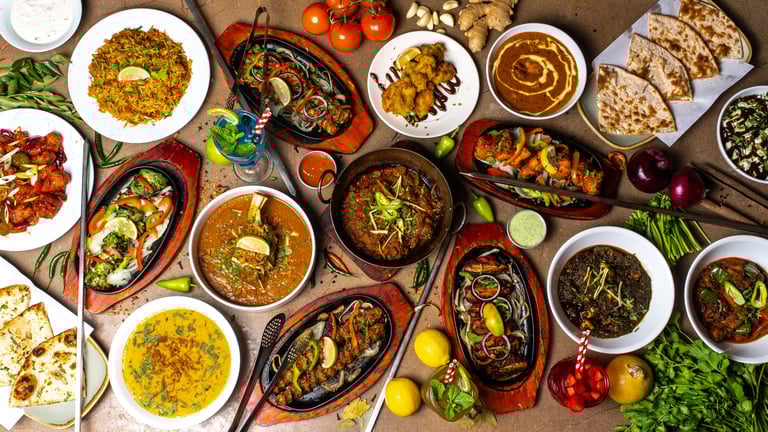 Group food hero image on a table with skewers