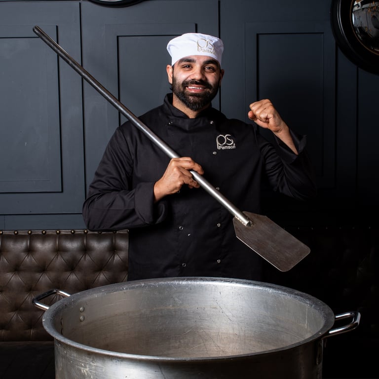 Catering headshot with pot and large spatula