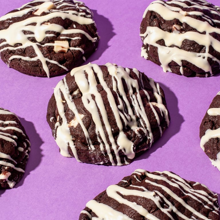 White chocolate dark cookie in the centre around other cookies.