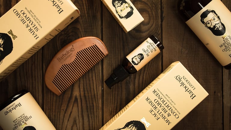 Collection of mens grooming products caught in birds eye view