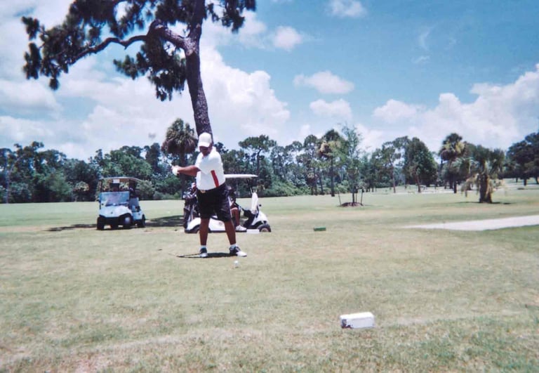 Par Four Golf Club image of black golfer about to hit the golf ball