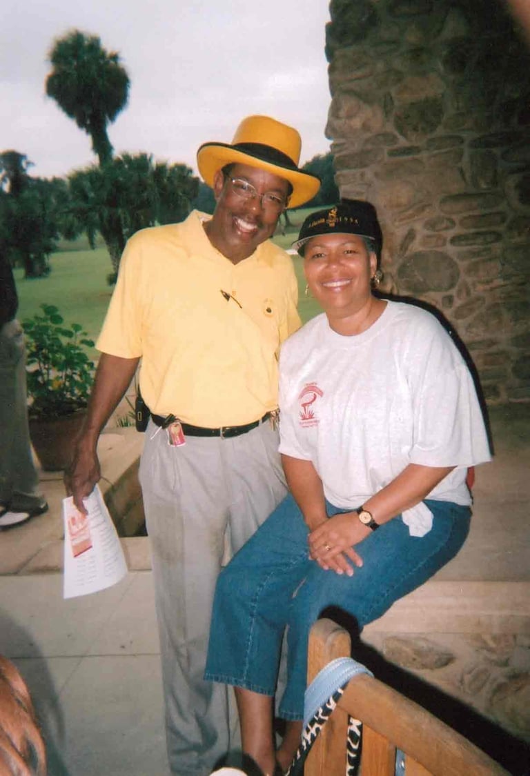 Par Four Golf Club image of two golfers posing for the camera