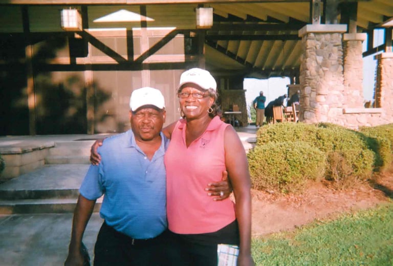 Par Four Golf Club image of two golfers posing for the camera
