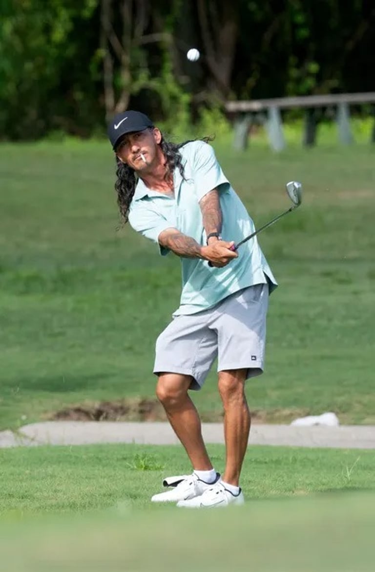 Par Four Golf Club image of Justin Corben hits onto the green during the final day of the Calvin Washington Memorial 50th Ann