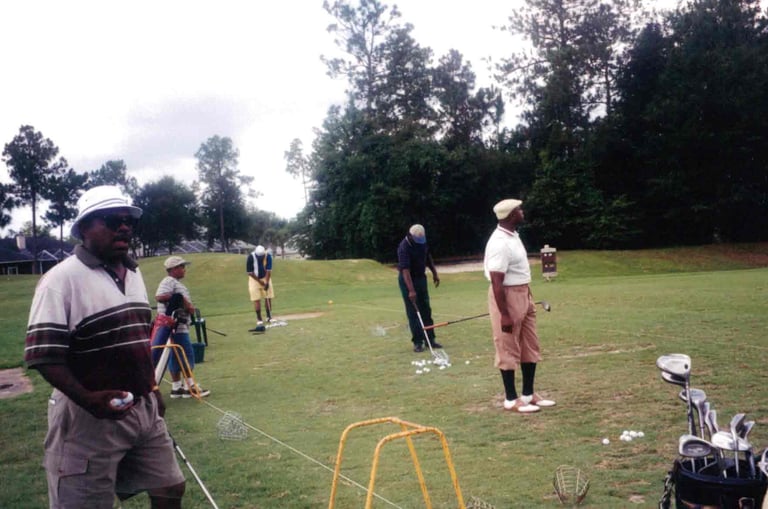 Par Four Golf Club image of black golfers about to hit the golf ball
