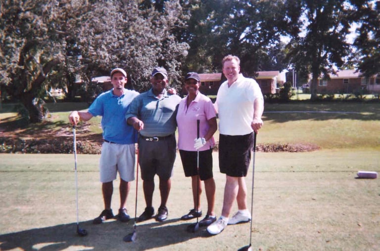 Par Four Golf Club image of four golfers posing with clubs