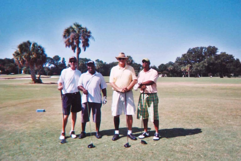 Par Four Golf Club image of four golfers posing with their golf clubs